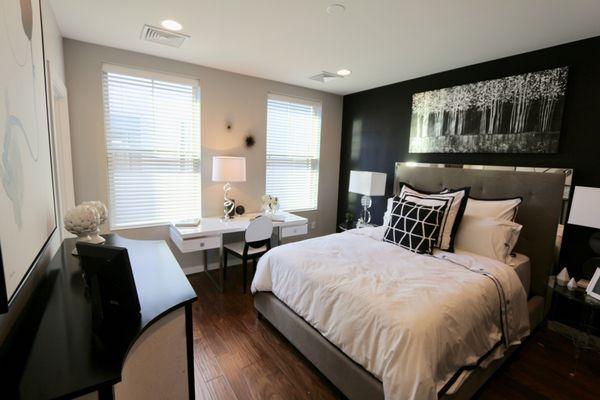 Master bedroom windows covered with Hunter Douglas Parkland Wood blinds.