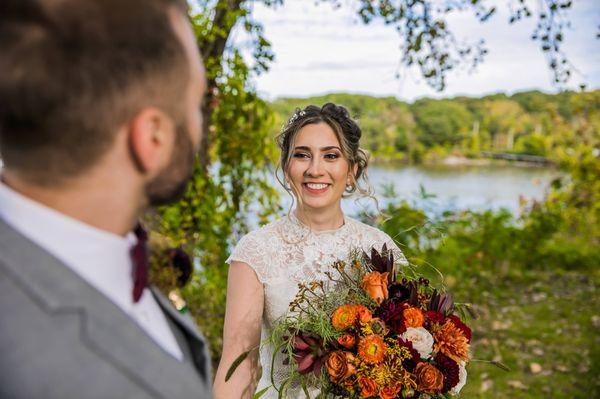 Fall Boho Bohemian wedding with orange, red, and green, and brown flowers and roses. Outdoor