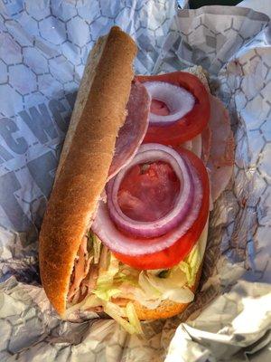 Half Italian with provolone, lettuce, tomato, red onion, mayonnaise and oil & vinegar.