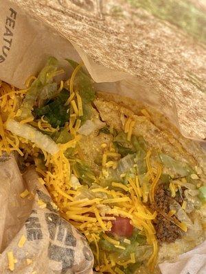 Disgusting soggy lettuce taco. I wouldn't feed this to my dog.