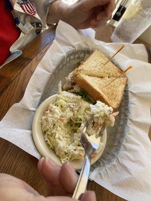 Chicken salad sandwich and slaw. Toasted bread and plenty of chicken salad.