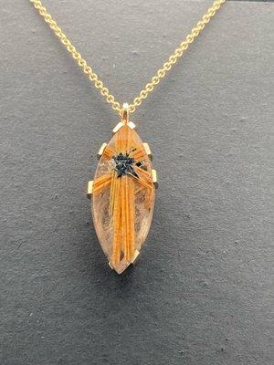 Custom pendant featuring a marquis-shaped rutile quartz gemstone prong-set  in a handcrafted 14k yellow gold mounting. An Apricot original.