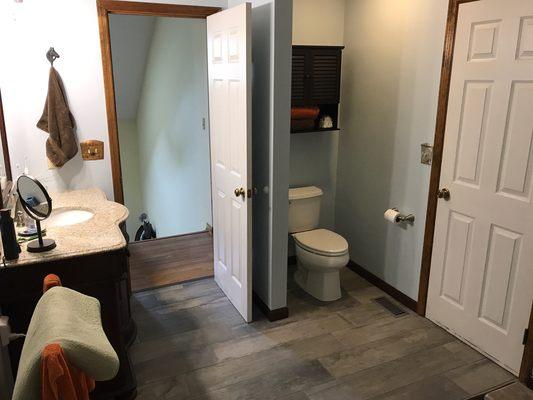 New plank tile and vanity gives this bathroom in Marengo a new vibe.