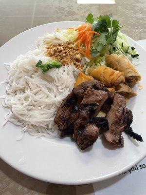 Vermicelli plate with spring roll and pork