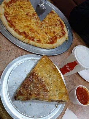 Medium cheese pizza, and stuffed meat lovers pizza with a side of Marinara sauce.