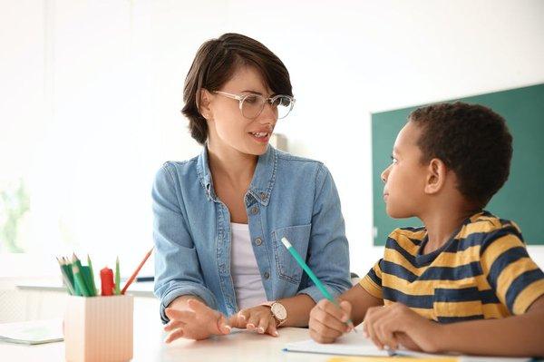 Private Tutor Teaching Elementary School Student