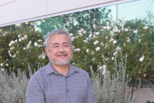 Dr. Tong in front of our brand new office located in Valencia.