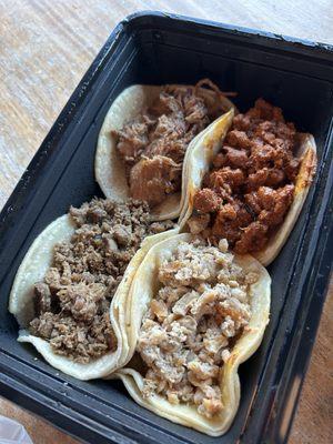 Pollo, carnitas, adobada, asada tacos (comes with onion and cilantro, got them on the side)