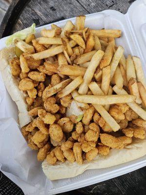 Shrimp poboy with a side of fries