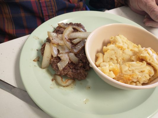 Hamburger steak with mac and cheese.