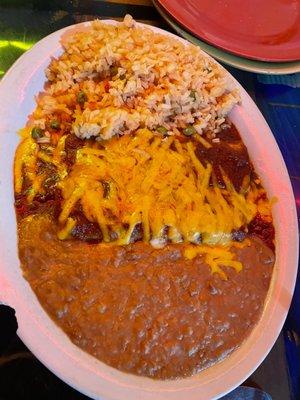 Cheese enchiladas with a sweet red sauce.