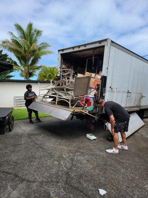 The garden furniture strapped to the back of their truck.