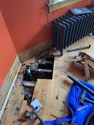 Floor removal in the dining room- moved the pipe from where you see it, to where the radiator is.