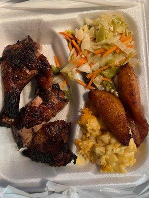 Jerk Chicken, macaroni and cheese and cabbage