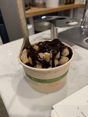 Brownie batter ice cream topped with cookie dough bits and hot fudge