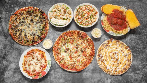 Indulge in our delicious spread of pizza, pasta, fresh salads, hearty sandwiches, and a sweet slice of dessert pizza to top it all off!