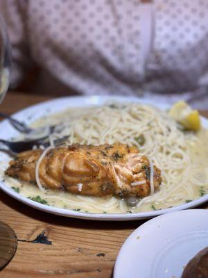 Salmon Picatta - Sautéed in white wine, lemon, butter, and capers, served over homemade spaghetti pasta.