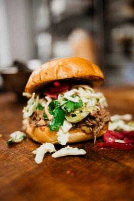 Green chili pulled pork sandwich