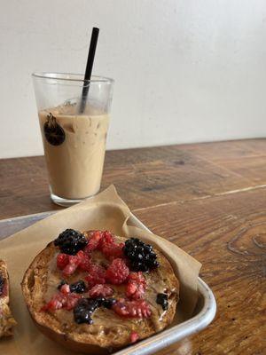 Iced raspberry beret latte & cinnamon bagel with almond butter and berries  so good!