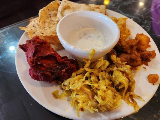 From the buffet - Tandoori chicken, potatoes, cabbage, raita, vegetable korma, naan, papad, rice