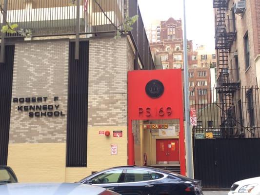 Entrance through the red door.