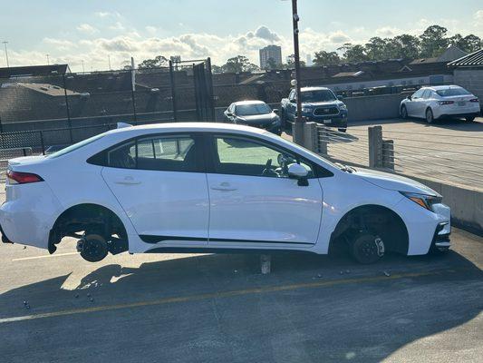 Car on bricks with tires stolen due to lack of security