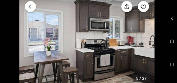 LVP Flooring, white quartz countertop, and shaker cabinets