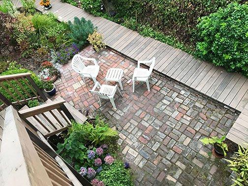 Brick patio surrounded by plantings