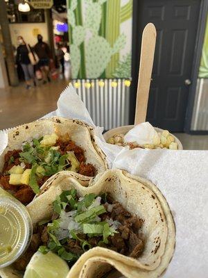 Al Pastor and Asada tacos with corn in a cup