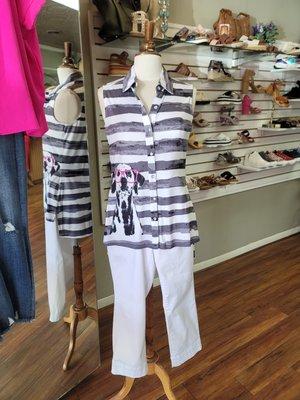 White and black striped shirt paired with white denim pants on a mannequin