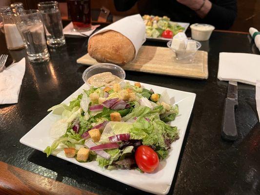 Salad and fresh baked loaf of bread. Great!