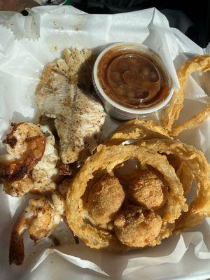 Grilled shrimp, grilled catfish, hush puppies, baked beans, and onion rings