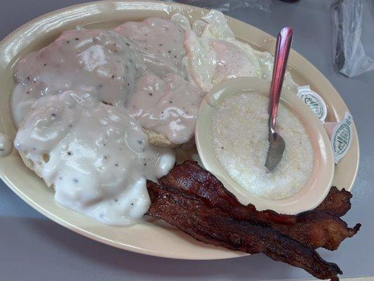 Double biscuit and gravy with grits eggs and bacon