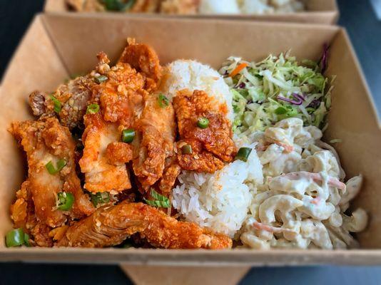 Spicy Sesame Chicken - Tri-Pepper rubbed thigh, fried and tipped with wing sauce, fried garlic, green onion, cilantro, Thai chilis