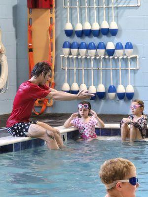 Teaching them Breast Stroke.