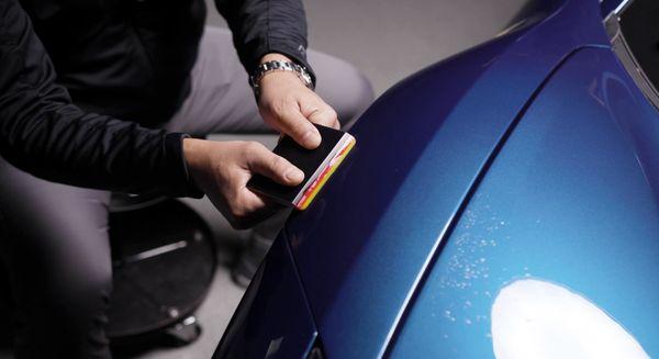 Our expert installer in the zone getting our customers vehicles front end wrapped with our PPF.