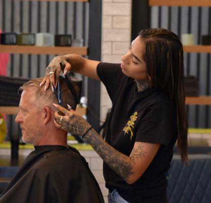 Barbers providing the best haircuts in town.