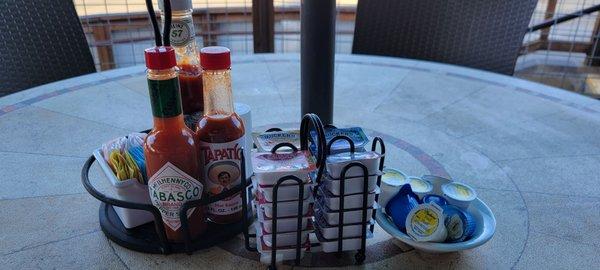 Tabasco/Tapatio, half and half, four types of Smucker's jam, and all the salt and pepper you want!