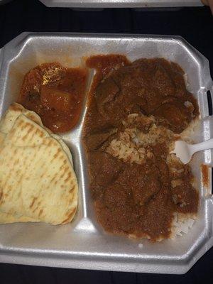 flat bread, potatoes and spinach, and lamb curry  Lamb Korma Curry Combo