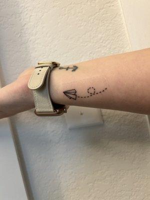 Paper airplane tattoo