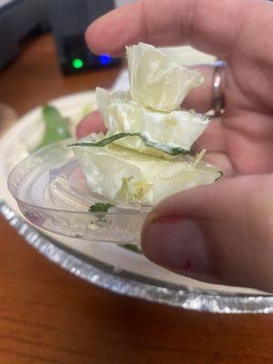 Butt end of a head of lettuce. Inside my $25 bowl of rice, with chicken sprinkles and a lettuce nitemare.