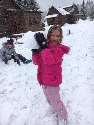 Snowball fights behind the cabin