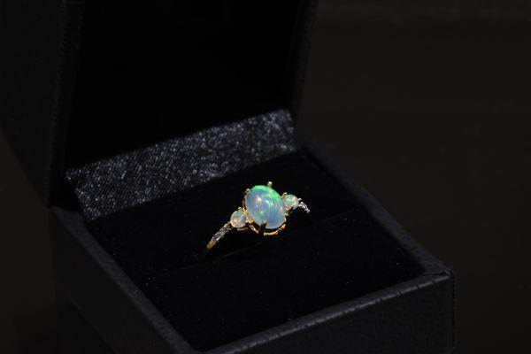 Opal and diamond ring