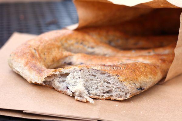 Inside of Fougasse ($9) - herbed levain dough w 10% whole wheat, 90% refined wheat, duck fat, preserved lemons, Kalamata olives, olive oil