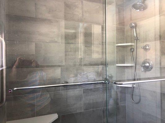 My shower with safety rails and an amazing shower head.