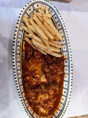 Shakshuka mergez : lamb sausage, vegetable, egg, homemade harissa, fries and french baguette. It's a traditional Tunisian plate.