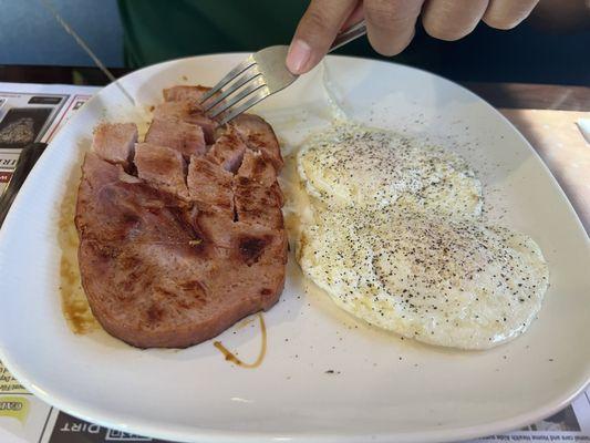 Ham, eggs, grits, toast, coffee & a juice...just one of the many reasonable specials!