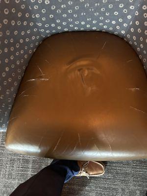 Leather chairs seat with cracked leather