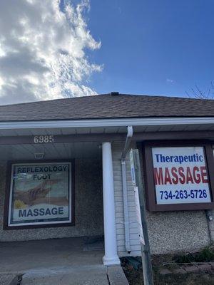 Walking up to Therapeutic Massage, the front door is on the right.