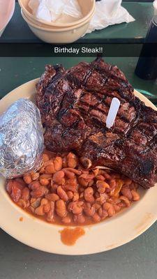 Rib Eye, baked potato and ranch beans.